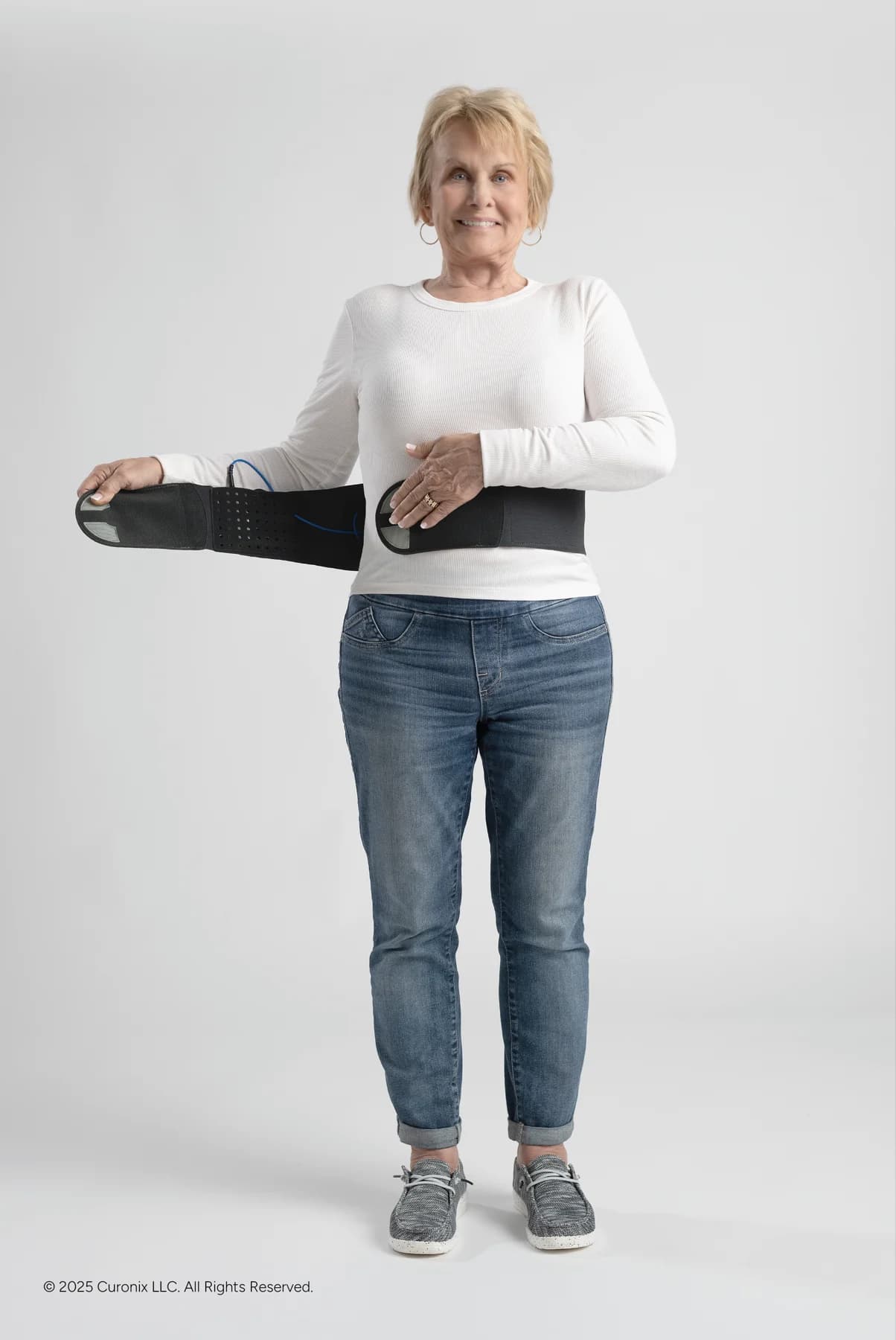 Model demonstrating the Freedom PNS torso wearable over clothing