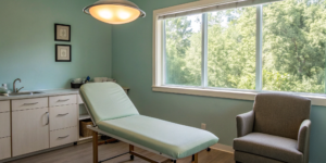 Medical exam room with a treatment table for a cervical facet radiofrequency neurotomy.